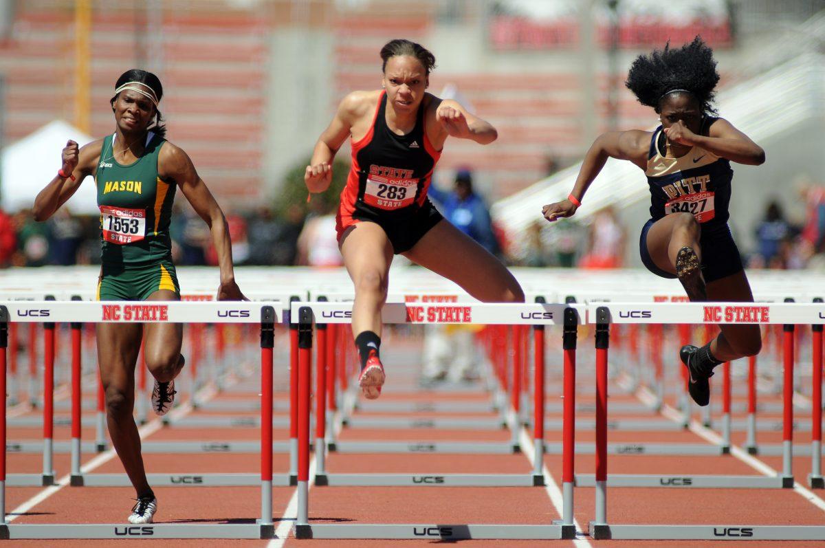 Freshman Alexis Perry leaps over a hurdle during the women's 110 meter hurdles at the Raleigh Relays Friday, March 29, 2013. Perry finished with a time of 13.82 seconds and qualified for the finals on Saturday at the Paul H. Derr Track.