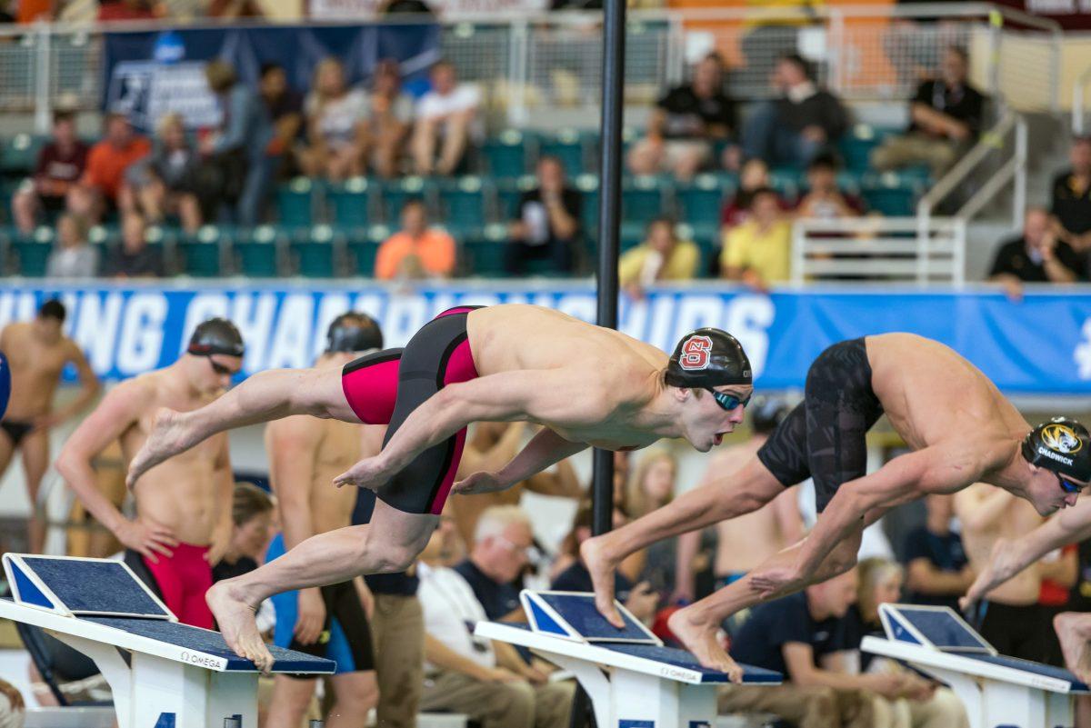 Sophomore Ryan Held soars into the water at the NCAA Championships. The NC State men's swimming and diving team placed fourth in team standings, including a first-place finish in the 400 relay in which Held participated in.