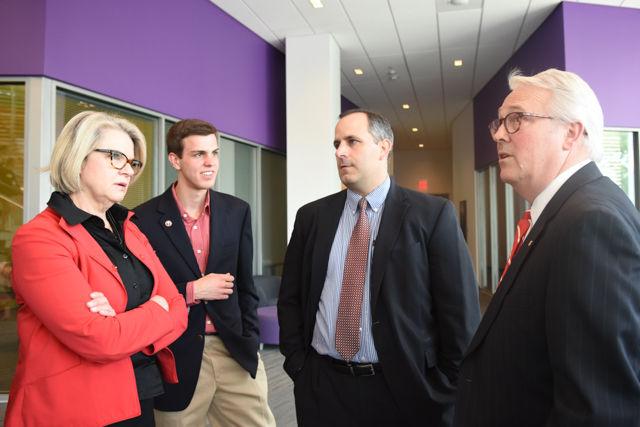 Maragaret Spellings, former secretary of education and current president of the University of North Carolina School System, Paul Nolan, a senior studying material science and engineering and Student Body President, Mike G, and Chancellor Randy Woodson, discuss the features of Talley Student Union during there tour of North Carolina State University on April 20. 2014.