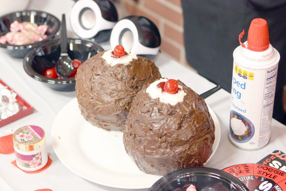 A chocolate breast cake attracts visitors to the Sexual Aphrodisiacs table at the Sexual Communications Fair in Talley Student Center on Nov. 29, 2012.