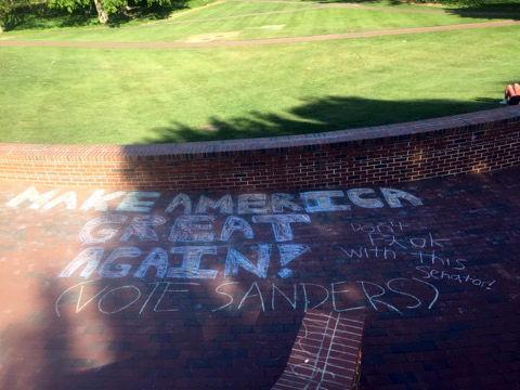 "MAKE AMERICA GREAT AGAIN," Donald Trump's rallying cry, is written in bold chalk lettering on the steps leading to the Court of the Carolinas on Monday, April 18, 2016. Supporters of Senator Bernie Sanders added "don't f*** with this senator!" and in parentheses, "VOTE SANDERS."&#160;