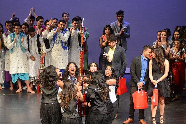 Members of Temple University's Temple Agni dance team celebrate their first place finish in Oak City Revolution, a Bollywood Fusion dance competition held in Stewart Theatre at Talley Student Union on Saturday, April 2nd.