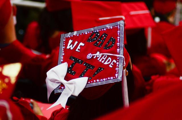 A "Dad we made it" decorated cap sits on a graduate&#8217;s head on May 7, 2016 in PNC Arena during the 2016 Commencement Ceremony.