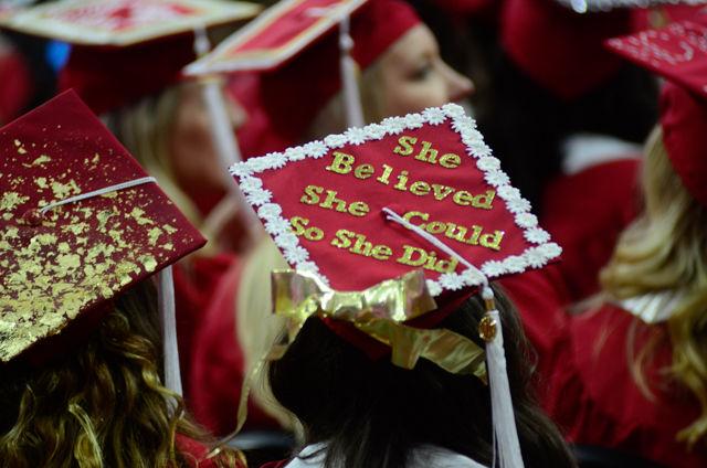 A "She believed she could so she did" decorated cap sits on a graduate&#8217;s head on May 7, 2016 in PNC Arena during the 2016 Commencement Ceremony.