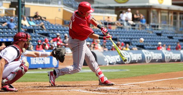 Sophomore infielder Evan Mendoza makes contact with a pitch during the first round ACC Baseball Tournament game at Durham Bulls Athletic Park on May 25. Mendoza went 0 for 4 with one RBI and a walk. The wolfpack lost to Florida State 7-3.