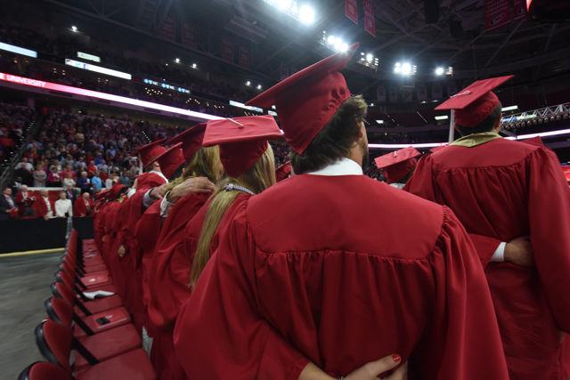 Undergraduates lock arms as they sing the alma mater in PNC Arena on May 7, 2016 during the 2016 spring commencement. During the 2016 spring commencement 5,596 undergraduate degrees were awarded. The commencement also featured an address from Adm. Michelle Howard, the first female four-star admiral, a musical interlude by the Ladies in Red and a student address by Tatiana DeBerry, a graduating senior in criminology.