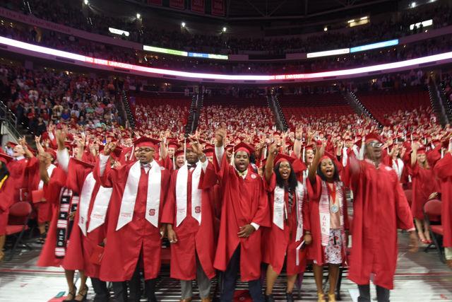 Undergraduates cheer and throw the wolfie as they sing the alma mater in PNC Arena on May 7, 2016 during the 2016 spring commencement. During the 2016 spring commencement 5,596 undergraduate degrees were awarded. The commencement also featured an address from Adm. Michelle Howard, the Navy's first female four-star admiral, a musical interlude by the Ladies in Red and a student address by Tatiana DeBerry, a graduating senior in criminology.