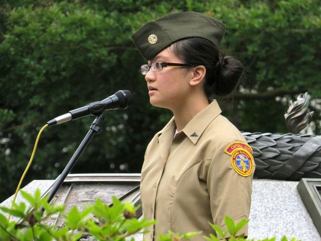 Hannah Miller, a Marine cadet, sings &#8220;God Bless America&#8221; at the Memorial Day wreath-laying ceremony at the Capitol on Monday.
