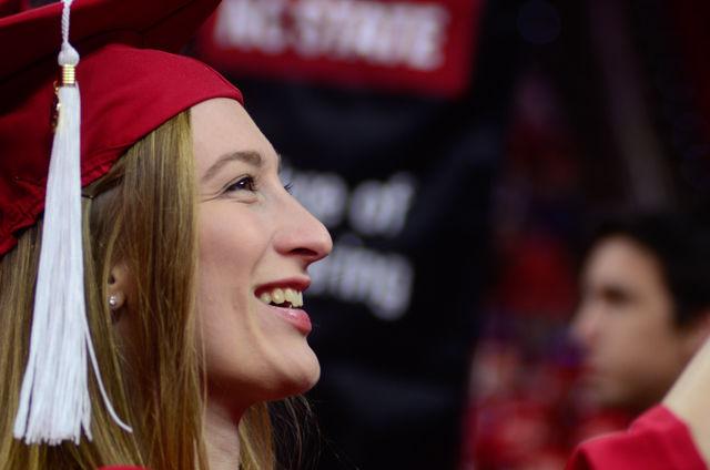A College of Engineering graduate looks into crowd as she enters PNC Arena on May 7, 2016 during the 2016 spring commencement. During the 2016 spring commencement 5,596 undergraduate degrees were awarded. The commencement also featured an address from Adm. Michelle Howard, the Navy's first female four-star admiral, a musical interlude by the Ladies in Red and a student address by Tatiana DeBerry, a graduating senior in criminology.