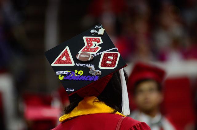 A Delta Sigma Theta decorated cap sits on a graduate&#8217;s head on May 7, 2016 in PNC Arena during the 2016 Commencement Ceremony.