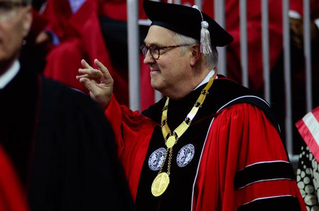 Chancellor Woodson throws the wolfie On May 7, 2016 in PNC Arena as he enters 2016 spring commencement. During the 2016 spring commencement 5,596 undergraduate degrees were awarded. The commencement also featured an address from Adm. Michelle Howard, the Navy's first female four-star admiral, a musical interlude by the Ladies in Red and a student address by Tatiana DeBerry, a graduating senior in criminology.