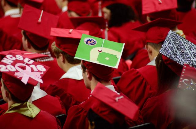 A New York Mets decorated cap sits on a graduate&#8217;s head on May 7, 2016 in PNC Arena during the 2016 Commencement Ceremony.
