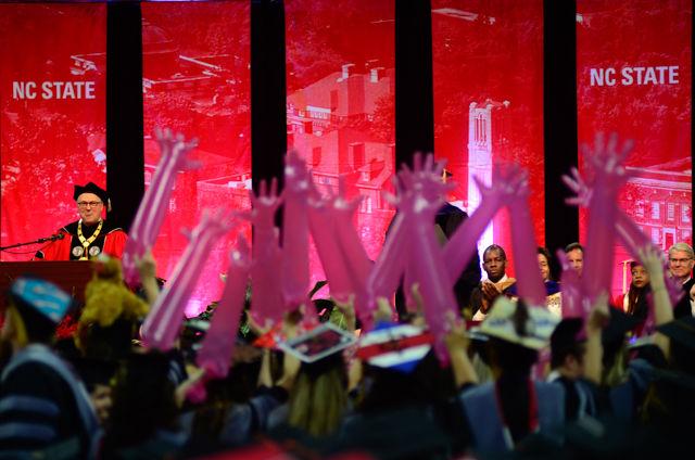 Chancellor Randy Woodson sticks his tongue out as he delivers the commencement of veterinary students on May 7, 2016 in PNC Arena during the 2016 spring commencement. During the 2016 spring commencement 5,596 undergraduate degrees were awarded. The commencement also featured an address from Adm. Michelle Howard, the Navy's first female four-star admiral, a musical interlude by the Ladies in Red and a student address by Tatiana DeBerry, a graduating senior in criminology.