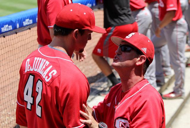 Pitching coach Scott Foxhall talks with sophomore pitcher Tommy Deluneasduring the first round ACC Baseball Tournament game at Durham Bulls Athletic Park on May 25. Deluneas allowed one hit and one run. The wolfpack lost to Florida State 7-3.
