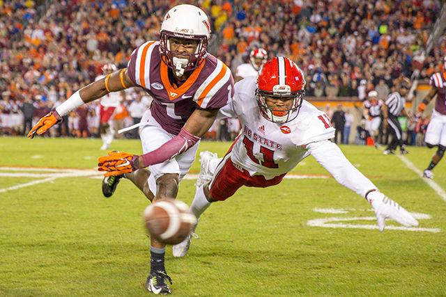 Graduate cornerback Juston Burris dives and covers the receiver, disallowing the catch against the Hokie receiver. Burris finished the game with three tackles and one tackle for a loss. The Wolfpack lost to the Hokies 28-13 at Virginia Tech in Lane Stadium on October 9th, 2015.