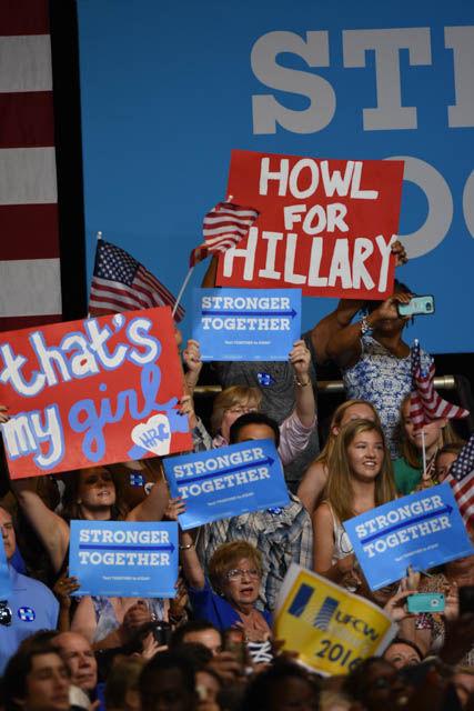Rally attendees hold signs in support of presidential candidate Hillary Clinton in the North Carolina State Fairgrounds Exposition Center during Clinton&#8217;s rally on Wednesday June 22.