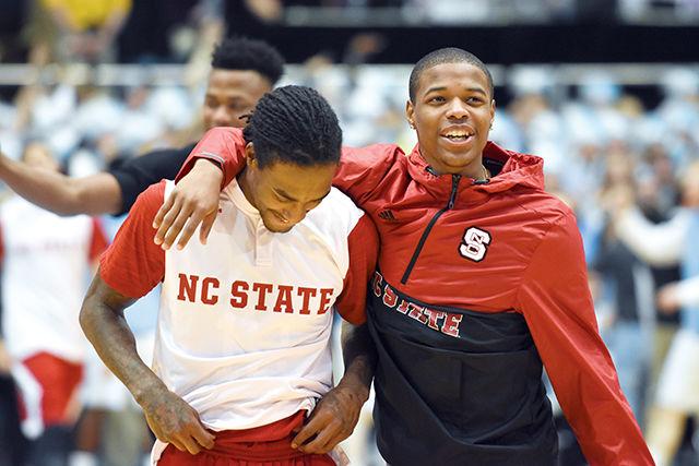 Junior guard, Cat Barber, shares a moment with freshman guard, Dennis Smith Jr., on Jan. 16 in the Dean Dome. The Wolfpack suffered a 67-55 loss marking its fifth-consecutive conference lost.