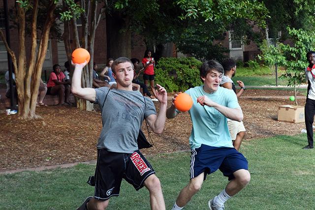Thomas Bullard, a freshman studying Exploratory Studies, and Matthew Sheldon, a freshman studying engineering, throw a dodgeball during a game of dodgeball at a cookout hosted by the SummerStart program. Summer START allows incoming freshman to enroll early during Summer Session two for five weeks of both academic and co-curricular activities. The cookout is one of the co-curricular activities that Summer START hosts to encourage students to mingle.