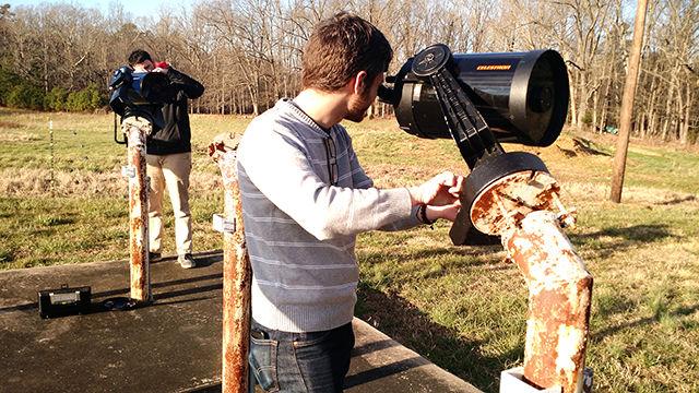 Sam Flynn and Charles Stapleford, both graduate students studying physics, check the alignment of two scopes for the NC State Astrophysics group open house held on Feb. 26.