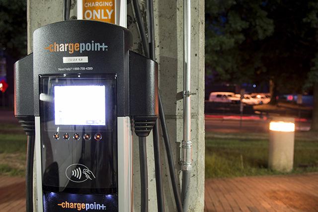 An electric car-charging station stands in the Dan Allen parking deck on Sunday. These stations require an electric vehicle parking permit and have four-hour charging limits from 7 a.m. to 5 p.m.&#160;