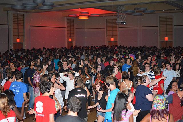 A huge crowd of students jam at Silent Disco in the Talley Ballroom on Friday, Aug 21, 2015. Everyone had a set of headphones and could choose from three different DJs to listen to.