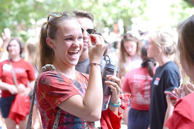 Nikki Desmarais, a freshman in the Life Sciences First Year Program, swabs her forehead looking for bacteria at a Life Sciences First Year Welcome Event in front of Bostian Hall on Tuesday. Desmarais, along with many other LSFY students who chose to swab different parts of their body for bacteria, rubbed her cotton swab on a cell culture plate. In a week the students will be able to see what kind of bacteria were present on their skin thanks to the LSFY advisers documenting the process. The welcome event, which was hosted by the advisers of LSFY, brought together students hoping to declare majors in the life sciences. The event included free ice pops, life science trivia and mingling with students and staff.