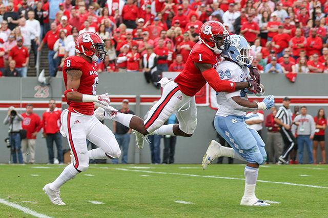Graduate safety Hakim Jones makes a diving tackle to stop a UNC-Chapel Hill touchdown in the first quarter. Jones finished with four solo tackles and six total tackles. The Wolfpack fell to the Tar Heels in the last home game of the season, 45-34 at Carter-Finley Stadium on Nov. 28.