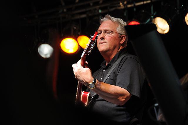 Chancellor Randy Woodson plays guitar with Carolina Liar at Packapalooza to celebrate NC State's 125th birthday.&#160;