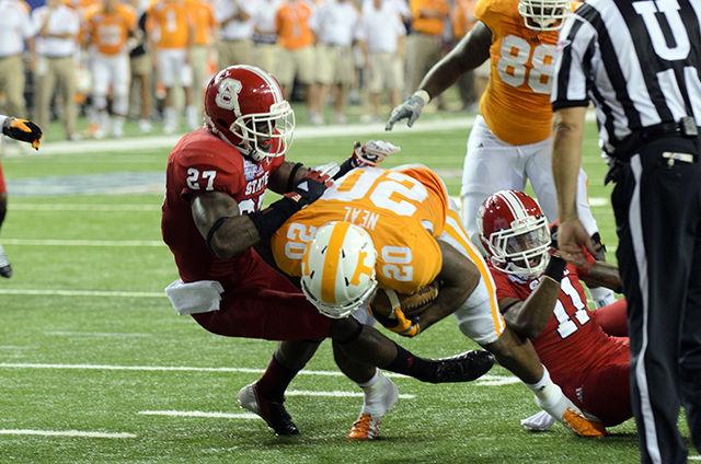 Safety Earl Wolff tackles a Tennessee tailback during the Chick-Fil-A Kickoff Game in the Georgia Dome Aug. 31, 2012. The Volunteers defeated the Wolfpack 35-21
