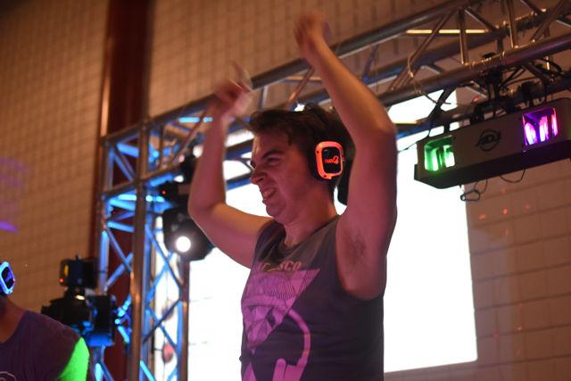 On Aug. 19 DJ Peter Lalush, a senior studying communications pumps up the crowd at Silent Disco. Throughout the night Lalush played a variety of electronic dance music as well as the Pokemon theme song.