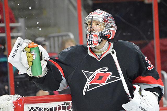 Cam Ward, the goaltender for the Carolina Hurricanes, drinks after re-entering the rink after second intermission. The Carolina Hurricanes played against the Vancouver Canucks on Friday, Jan. 15 in the PNC Arena. The Hurricanes lost against the Canucks in overtime, 3-2.