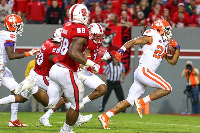 Wolfpack defenders fail to make a tackle against a Clemson running back during a touchdown by the Tiger offense. The NC State defense let up 623 yards, 27 first downs, five throwing touchdowns and two rushing touchdowns against the Clemson Tigers. The Wolfpack fell to the Tigers 56-41 in Carter-Finley Stadium at NC State, on Oct. 31.