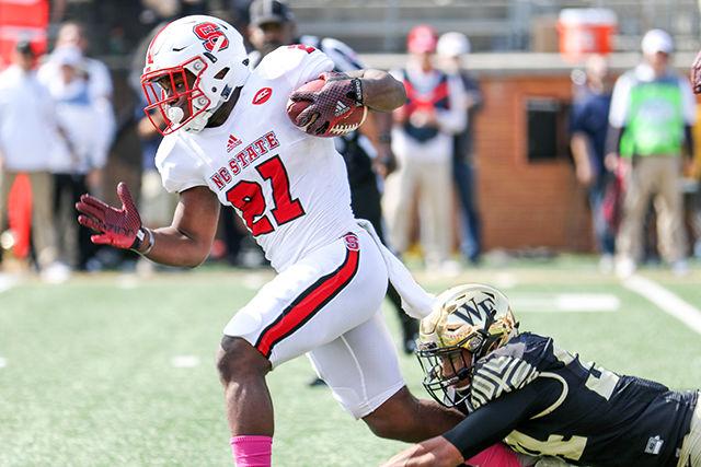 Junior running back Matt Dayes breaks a Wake Forest defender's tackle during a touchdown run. Dayes led the team with 16 carries for 205 yards. The Wolfpack dominated Wake Forest in the 35-17 win at BB&amp;T field in Winston-Salem on Oct. 24.