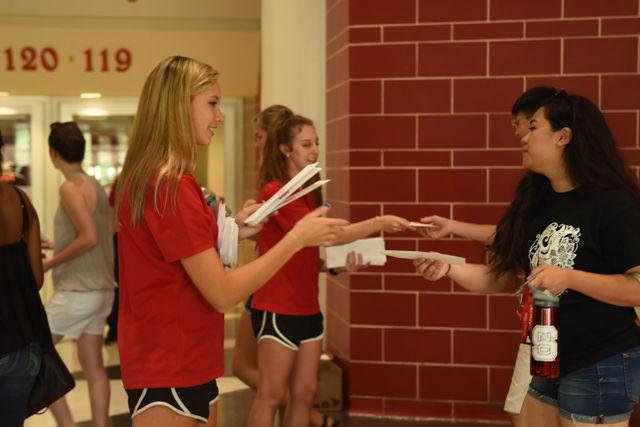 Sabrina Peverley, a freshman studying life sciences, receives an envelope containing her graduation tassel at the 2020 Convocation. Freshman Convocation was held at the PNC Arena on August 15, 2016.