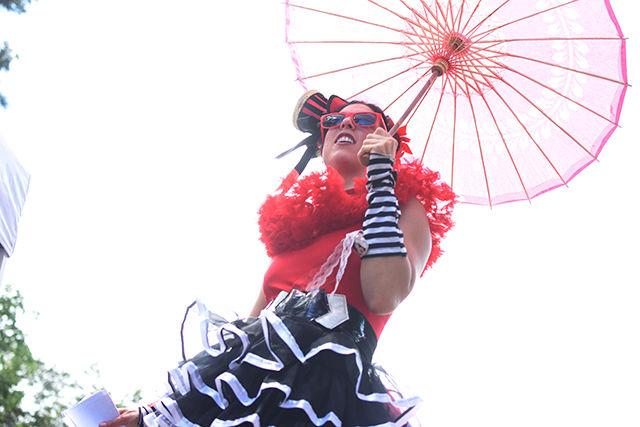 Walking on stilts, Liz Bliss grabs the attention of students at Packapalooza. Bliss handed out informational flyers for the circus group Cirque de Vol on Saturday. As a member of the circus, Bliss does fire stunts and stilt walking, but she is best known as an aerialist.&#160;