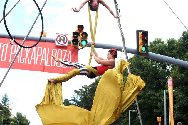 Aerialist Liz Bliss performs on Hillsborough street for Packapalooza on Aug. 20. Bliss represented Raleigh performance group Cirque de Vol as an aerialist and stiltwalker.