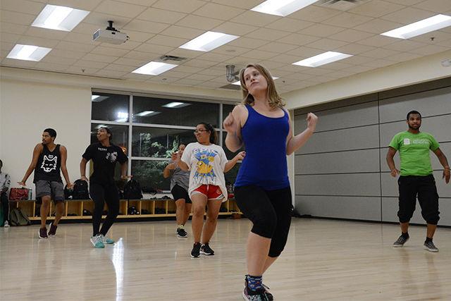 At Just Cuz Crew's first community dance class, Meg Kurdys, a sophomore majoring in international studies, dances with fellow sophomores on Tuesday. Just Cuz Crew hosted the community class in the Carmichael Recreation Center to get people interested in dance. They hope to have people come try out for their crew in September.&#160;