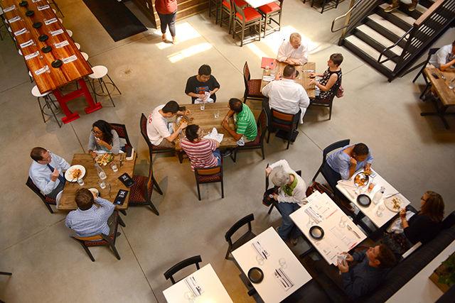 Restaurant-goers try out H-Street Kitchen during the first month of its opening on Aug. 22. Hillsborough Street's newest restaurant has a variety of different foods on the menu, including unique burgers, salads and snack plates. H-Street Kitchen, which is owned by two NC State alumni, is looking to "bring back the street" and revitalize the Hillsborough Street restaurant scene.
