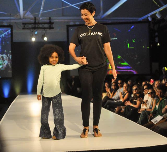 A young model wears a piece from Offsquare Thread's Offsquare Mini "Up Up and Away" line at fashionSPARK, a part of SPARKcon, on Sept. 16 at CAM Raleigh. The designer aimed to let kids be kids when designing the pieces seen in the collection.