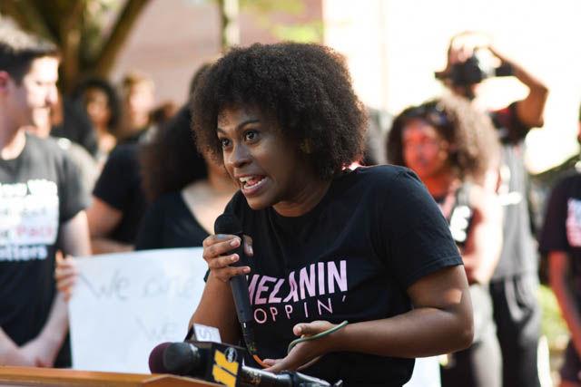 Achai Dent, a sophomore studying animal science and organizer of the NC State Blackout event, opens up the event explaining the struggle African-Americans face at the university. Students gathered in Wolf Plaza on Sept. 23 to listen to speakers and bring awareness to the recent events that took place in both Charlotte and Tulsa. "Some seem to think having one diversity conversation for 50 minutes per semester is more than enough, more than enough," said Dent.