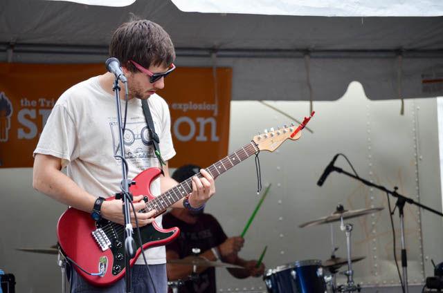 Brian Rogers, guitarist of Raid the Quarry, changes keys during his performance at SPARKcon on Sept. 18. Raid the Quarry has had several recent performances including MusicSPARK, Outer Vibe and Hopscotch. They will continue to play around at venues around the Triangle.