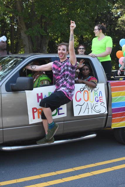 Supporters at the Pride Parade dance to music as they go down the street in celebration of gay pride at Duke University on Saturday. The parade at Duke University was just one of the many events for the NC Pride weekend.