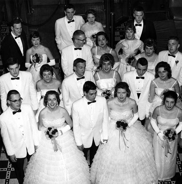 Circa 1960: Sigma Kappa girls pose with their dates at a pledge dance.&#160;