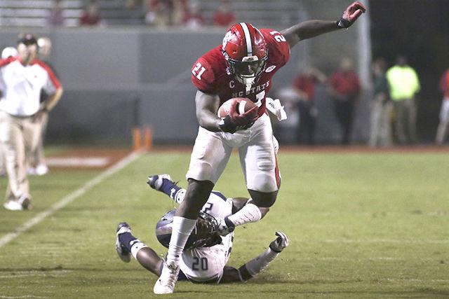 Senior running back Matt Dayes cuts back into the hole as he gets a block from redshirt sophomore offensive tackle Will Richardson in the Wolfpack's game against Old Dominion University on Sept. 17. Dayes caught four passes for 49 yards, rushed for 71 yards on 14 carries and had one touchdown in the 49-22 win at Carter-Finley Stadium.