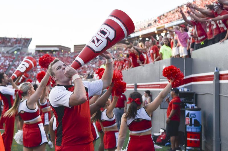 An NC State cheerleader rallies the fans at the game against Old Dominion at Carter Finley Stadium on Saturday, Sept. 17. NC State fans filled the stadium as they cheered on the Wolfpack to a win over Old Dominion.