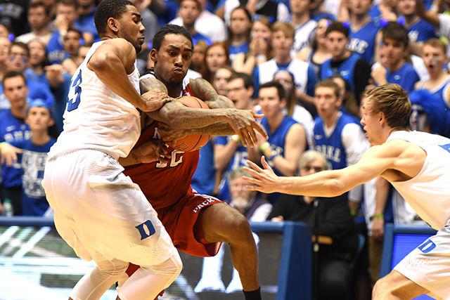 Junior guard Cat Barber gets caught in traffic while driving to the basket in the Wolfpack's 88-80 loss to Duke on Feb. 6. Barber racked up 26 points and six assists, and he grabbed four rebounds in the loss at Cameron Indoor Stadium.