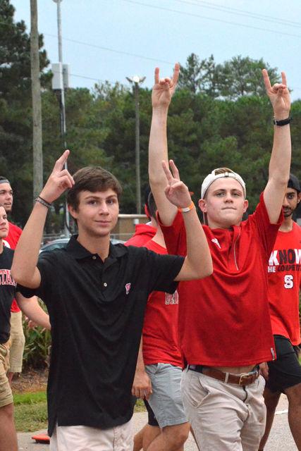 Students cross the street from the tailgate to the stadium prior to the Wolfpack's game versus William &amp; Mary on Sept. 1. Some students had to stand in line for an estimated 45 minutes before entering the stadium. The NC State beat William &amp; Mary 48-14.