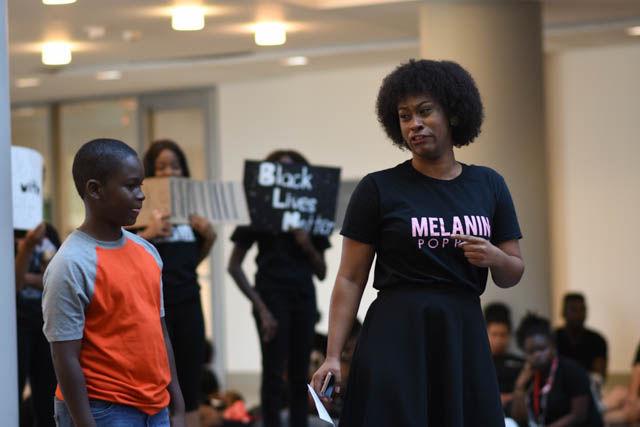 Achai Dent, a sophomore studying animal science and organizer of the NC State Blackout event, speaks on what it would be like to lose her little brother to police brutality during the die-in portion of the event. Participants covered the floor of the atrium in Talley Student Union on Sept. 23 in silence to represent all the lives lost to police brutality.