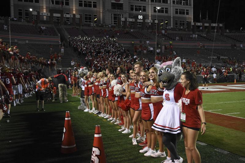 Cheerleaders line up with Mr and Mrs Wolf at the end of the football game against Old Dominion on Sept. 17 in Carter-Finley Stadium. The Wolfpack ended up with a 49-22 win over the Monarchs.