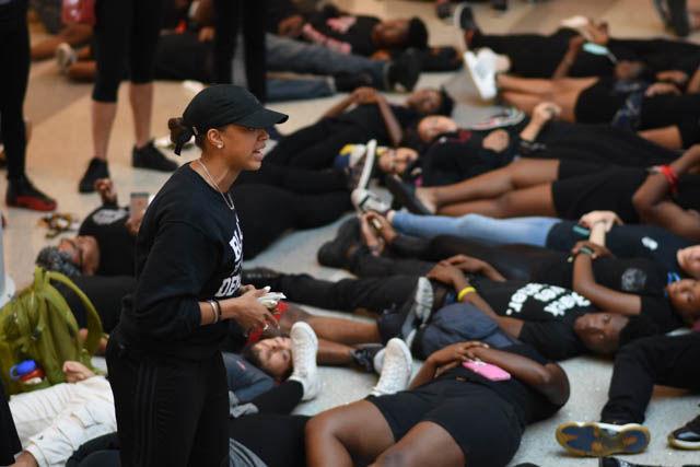 Cindi Ford, senior studying psychology, speaks during the die-in portion of the event. Participants covered the floor of the atrium in Talley Student Union on Sept. 23 in silence to represent all the lives lost to police brutality.